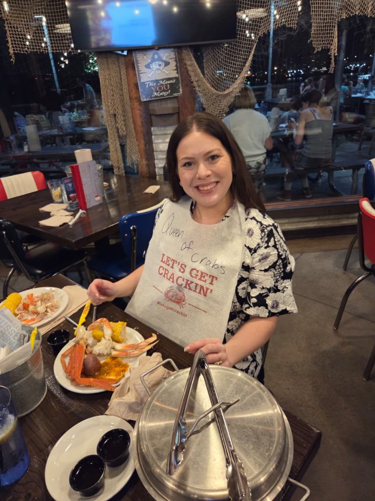 Eye care provider enjoying seafood during the Eye Hero community event in Louisville
