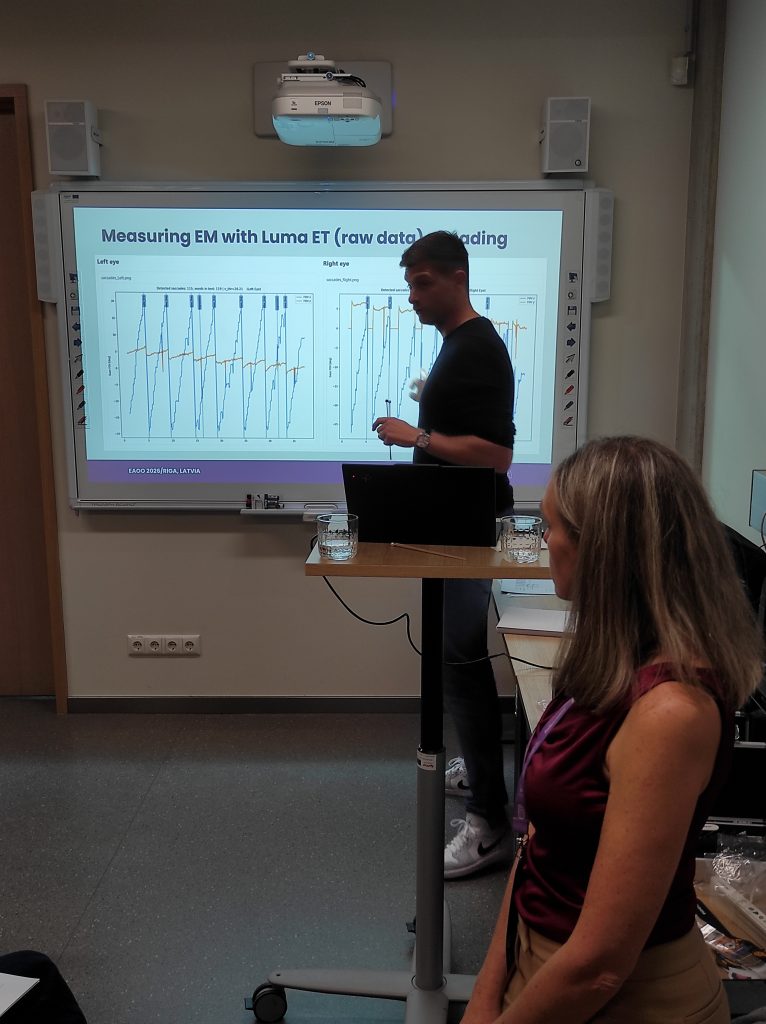 Matic Vogric presenting eye movement measurement methods during the Eye Tracking and Teaming Assessment workshop at EAOO 2026