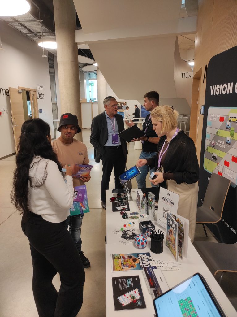 EAOO 2026 attendees learning about Eye Hero digital vision training tools at the conference in Riga