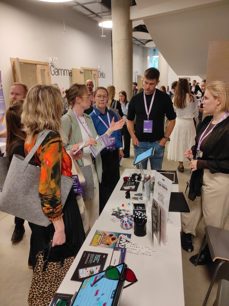 Matic Vogric and Anamaria Cuden presenting Eye Hero vision training activities to optometry professionals at EAOO 2026
