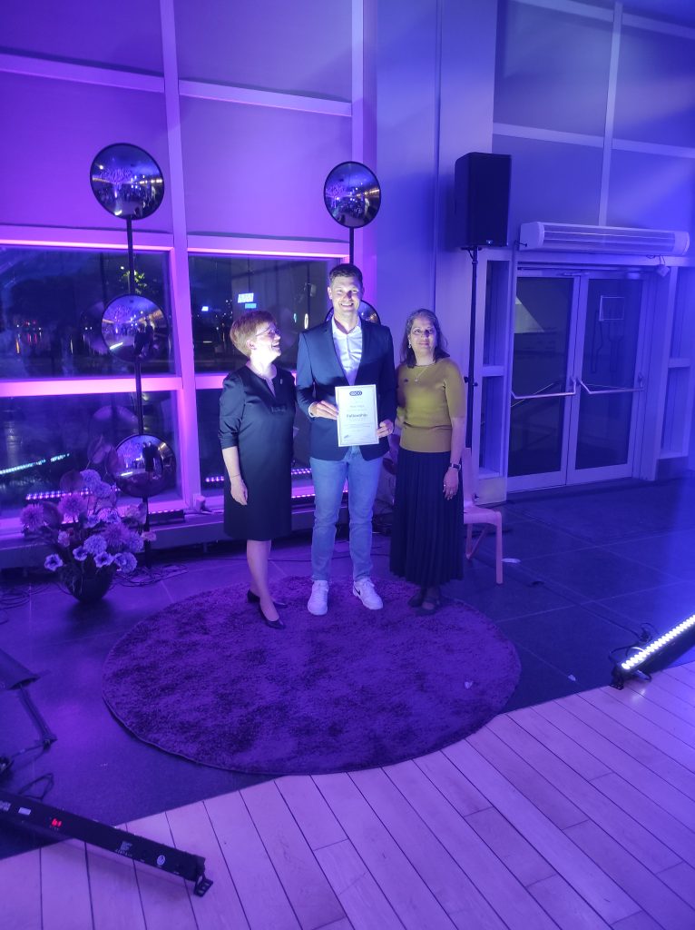 Matic Vogric receiving Fellowship recognition at the EAOO 2026 gala dinner