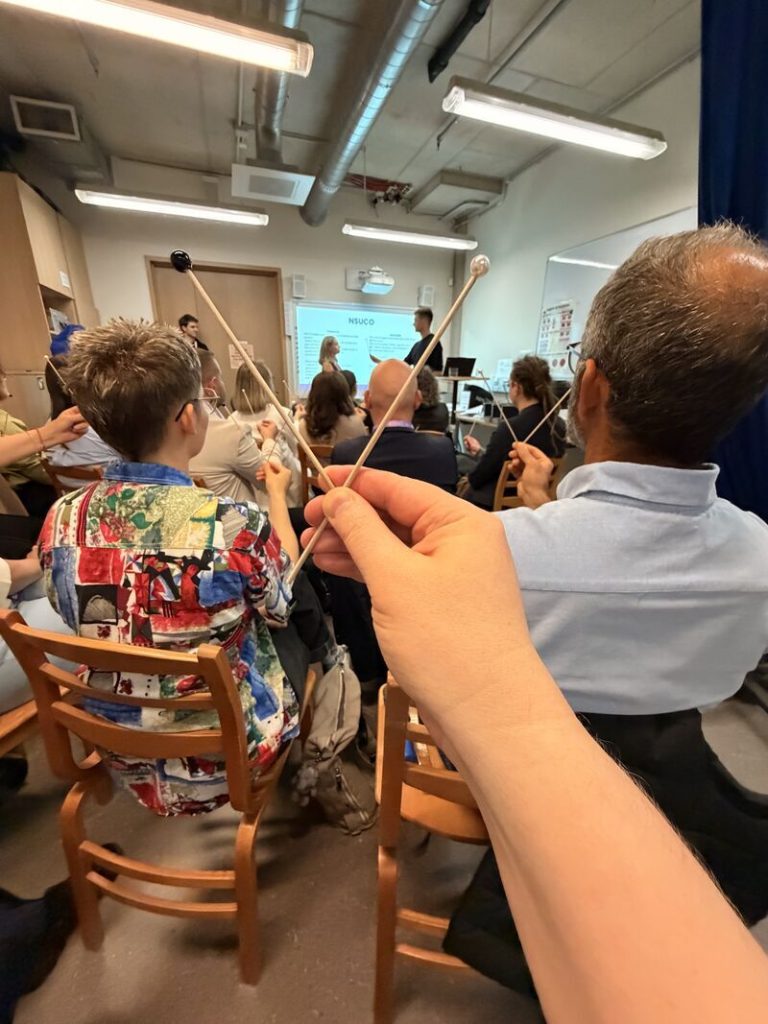 EAOO 2026 participants practicing eye teaming assessment during the Eye Tracking and Teaming Assessment workshop